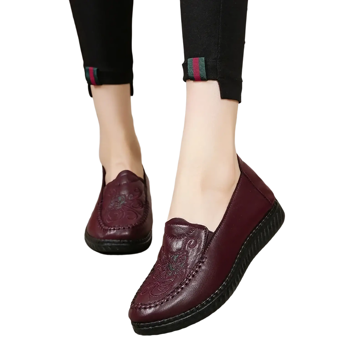 Burgundy leather slip on loafers with embroidered floral patterns and black rubber sole