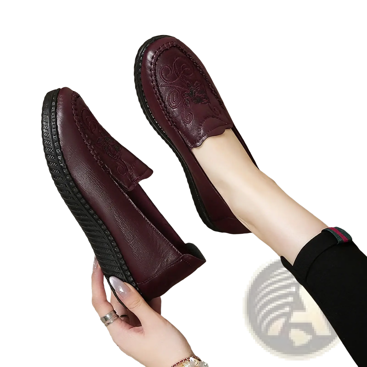 Burgundy embroidered leather slip on loafers with floral patterns and textured black rubber sole