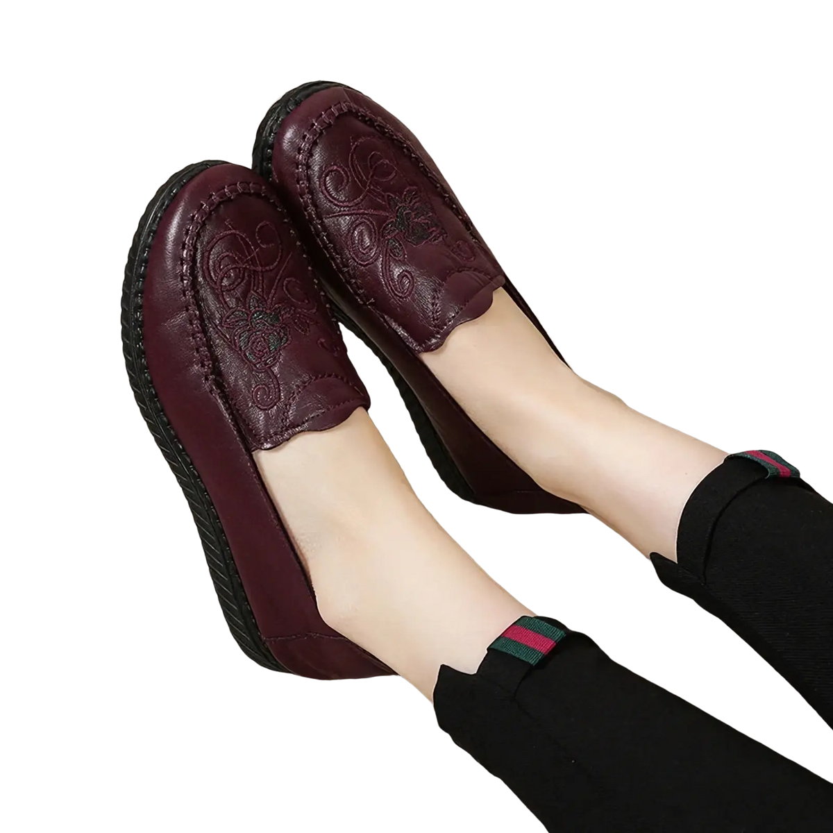 Embroidered leather slip on loafers in deep burgundy featuring intricate floral embroidery and a textured rubber sole