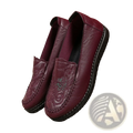 Marron leather slip on loafers with embroidered floral design and black rubber soles for stylish wear