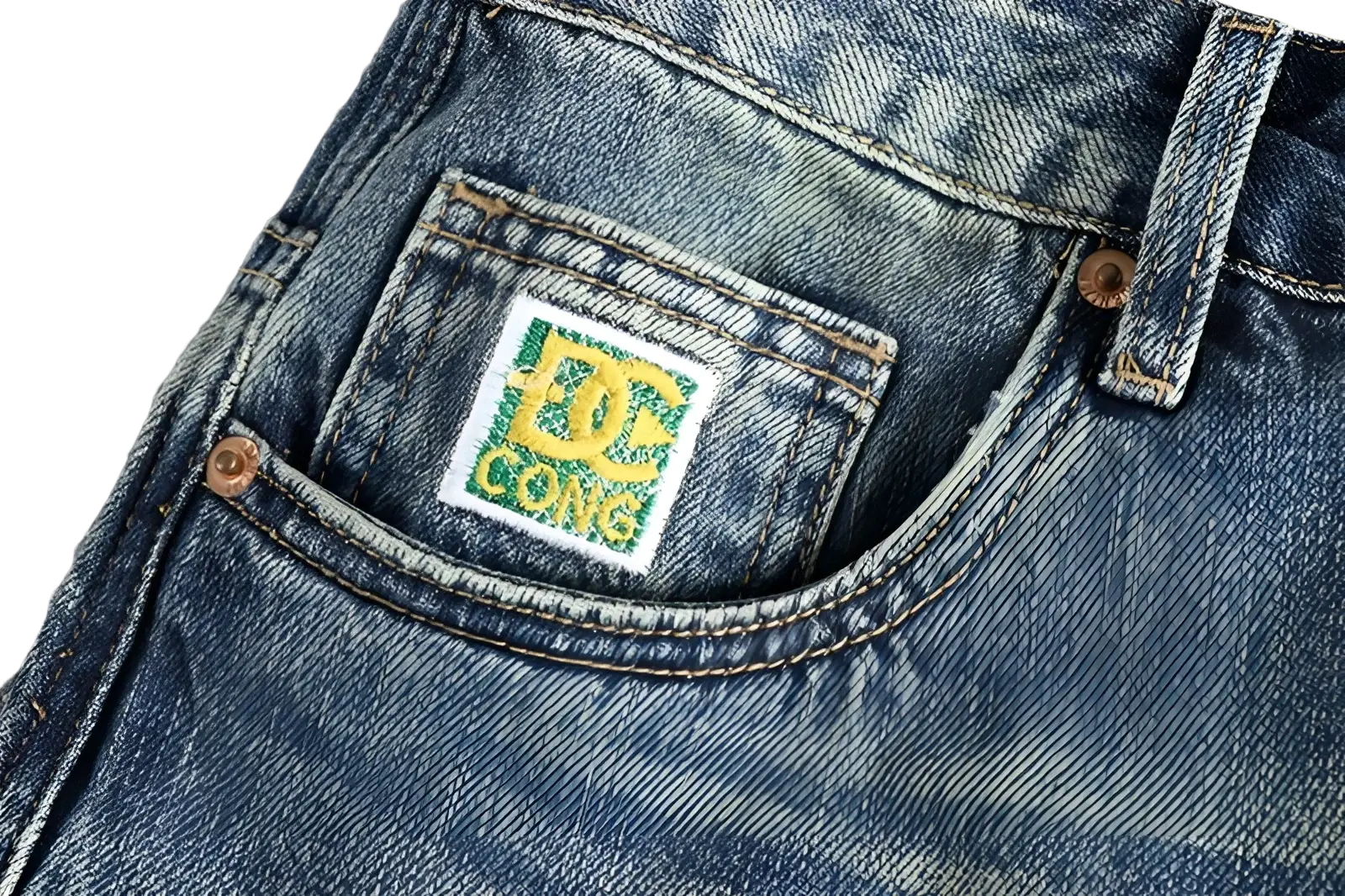 Embroidered loose fit blue denim jeans for men featuring a white dc comics logo patch with green and yellow lettering