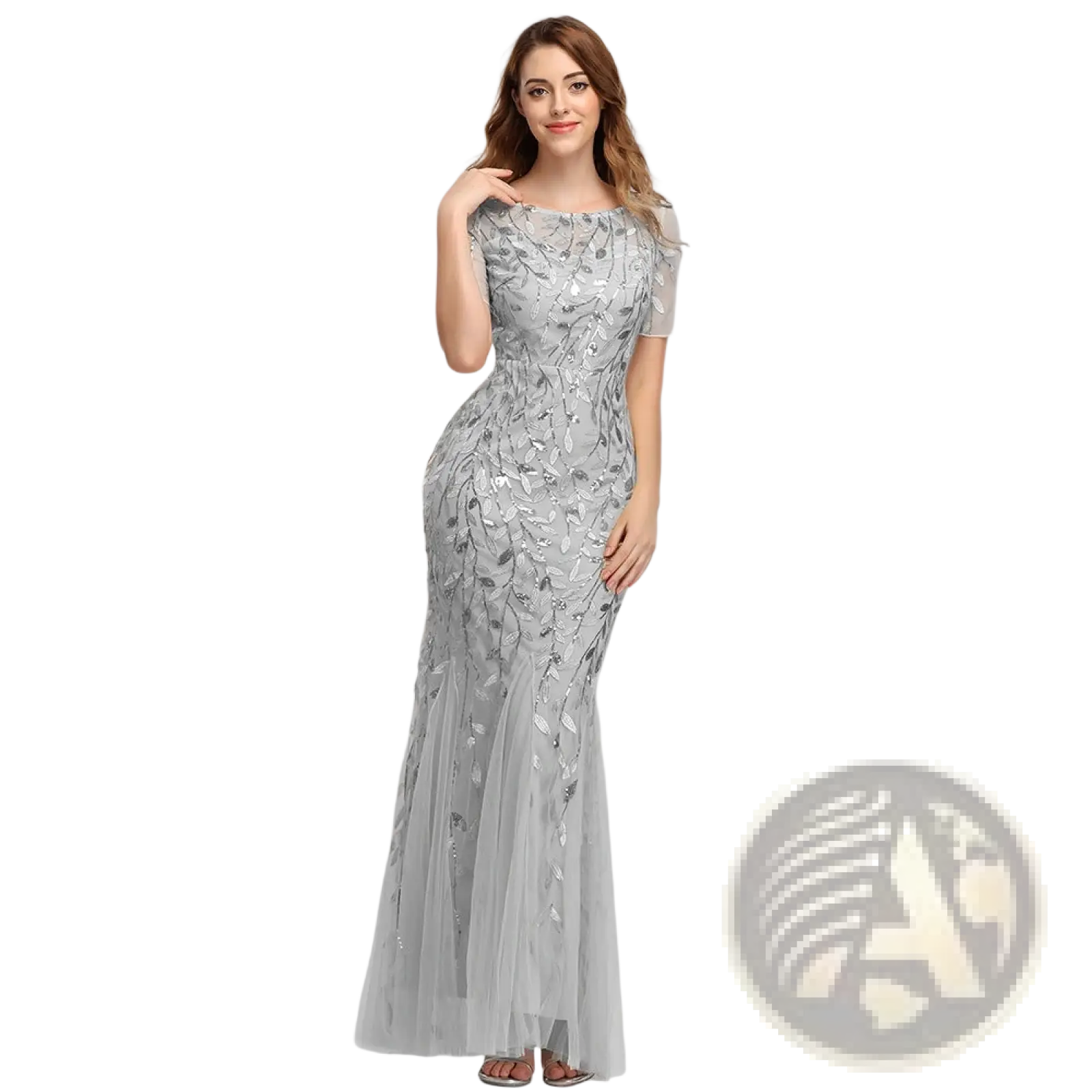 A shimmering silver embroidered sequin mermaid evening gown with layered tulle skirt and intricate leaf embroidery
