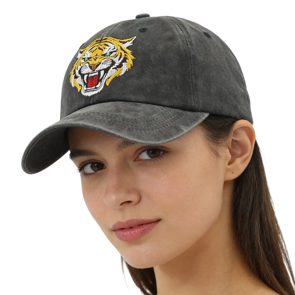 A dark gray distressed cotton baseball cap with a vibrant embroidered tiger face in yellow white and red
