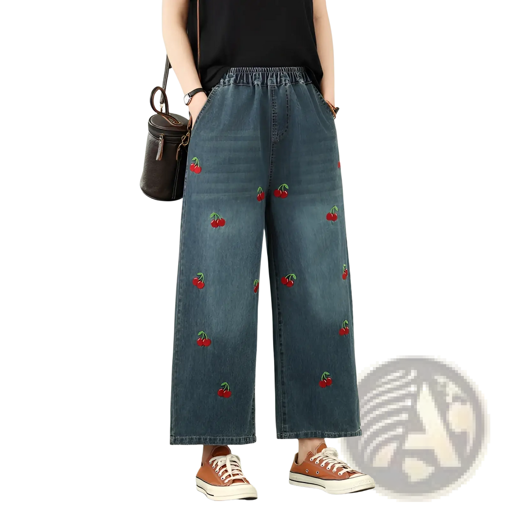 Blue denim wide-leg jeans with red cherry embroidery showcasing a stylish and casual design