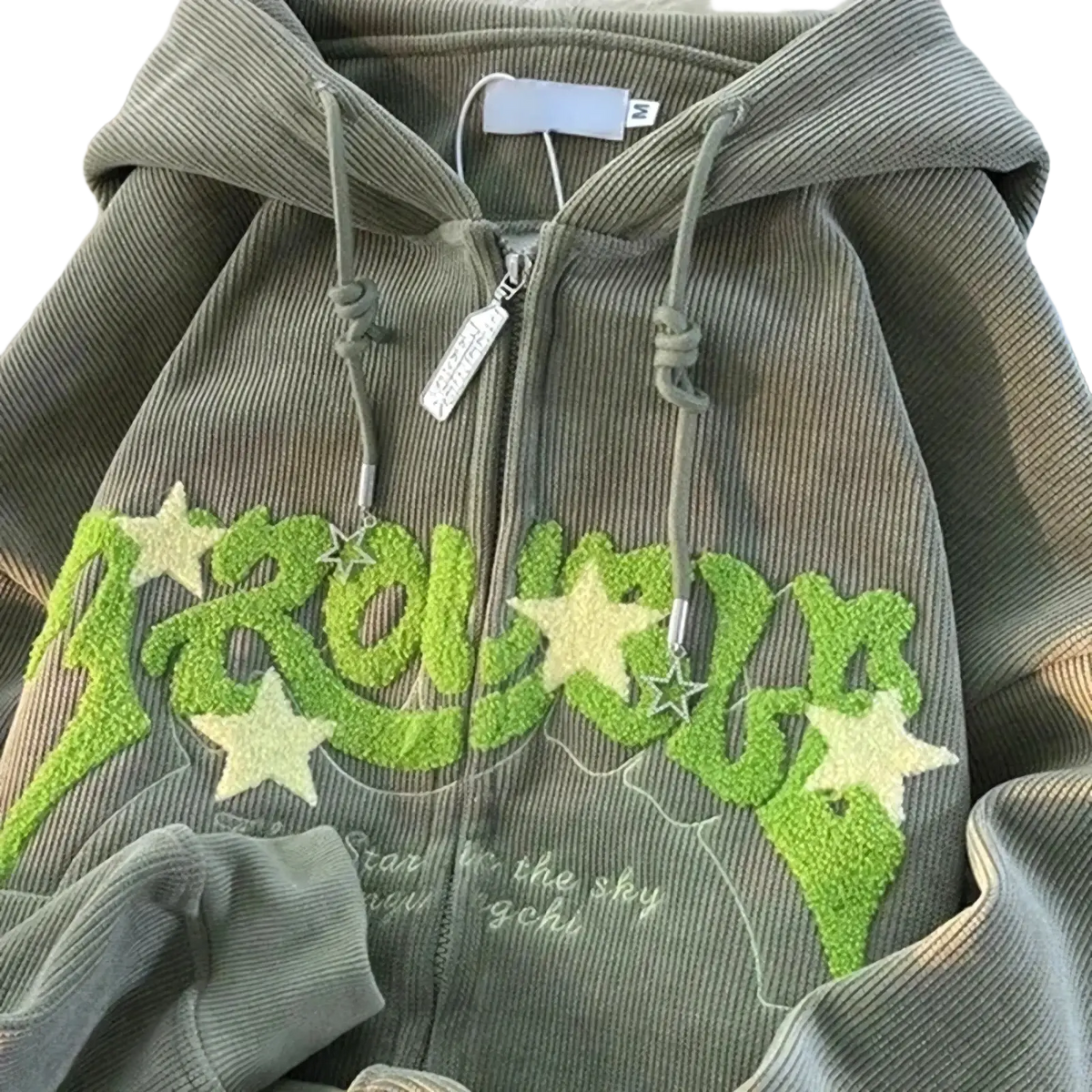 Olive green corduroy zip-up hoodie with lime green and white star appliqués embroidered in Y2k style