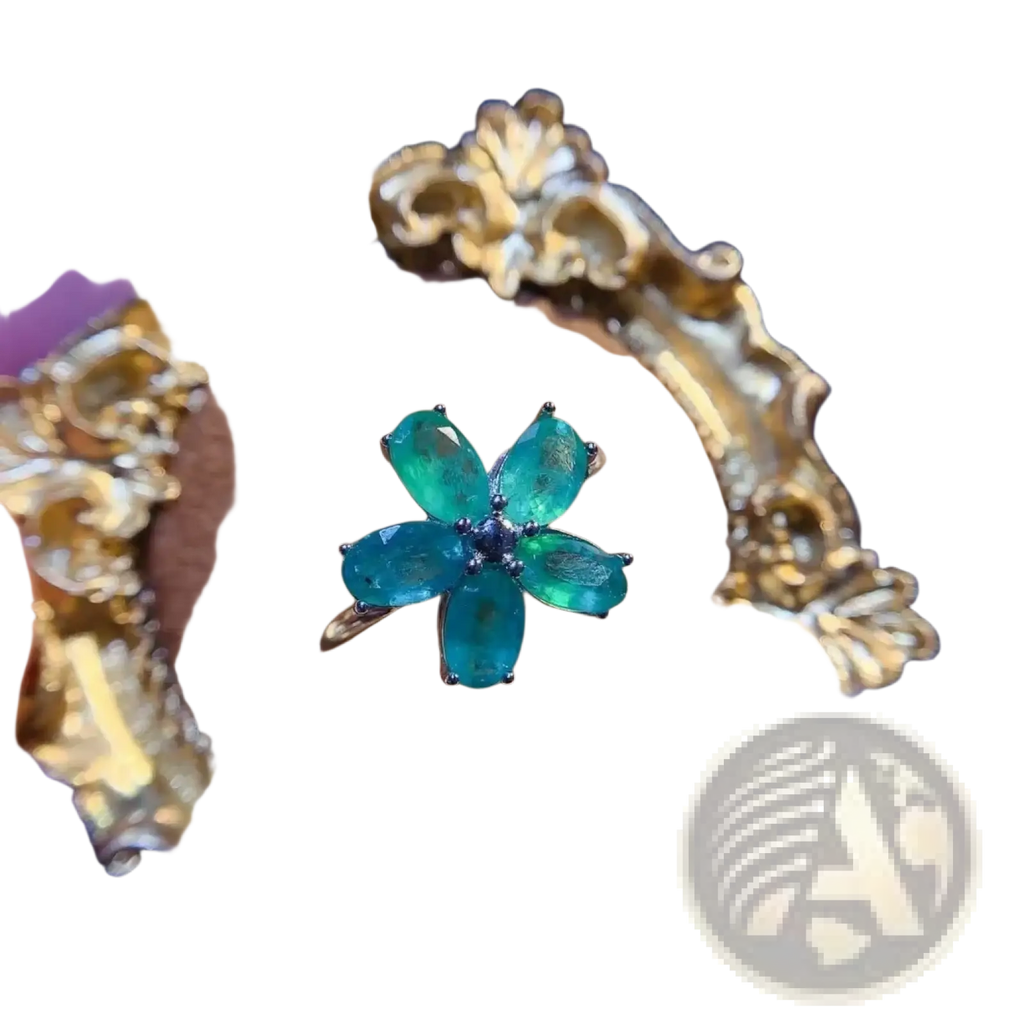 Emerald flower silver ring with five oval-cut green stones and dark blue center set in ornate gold band