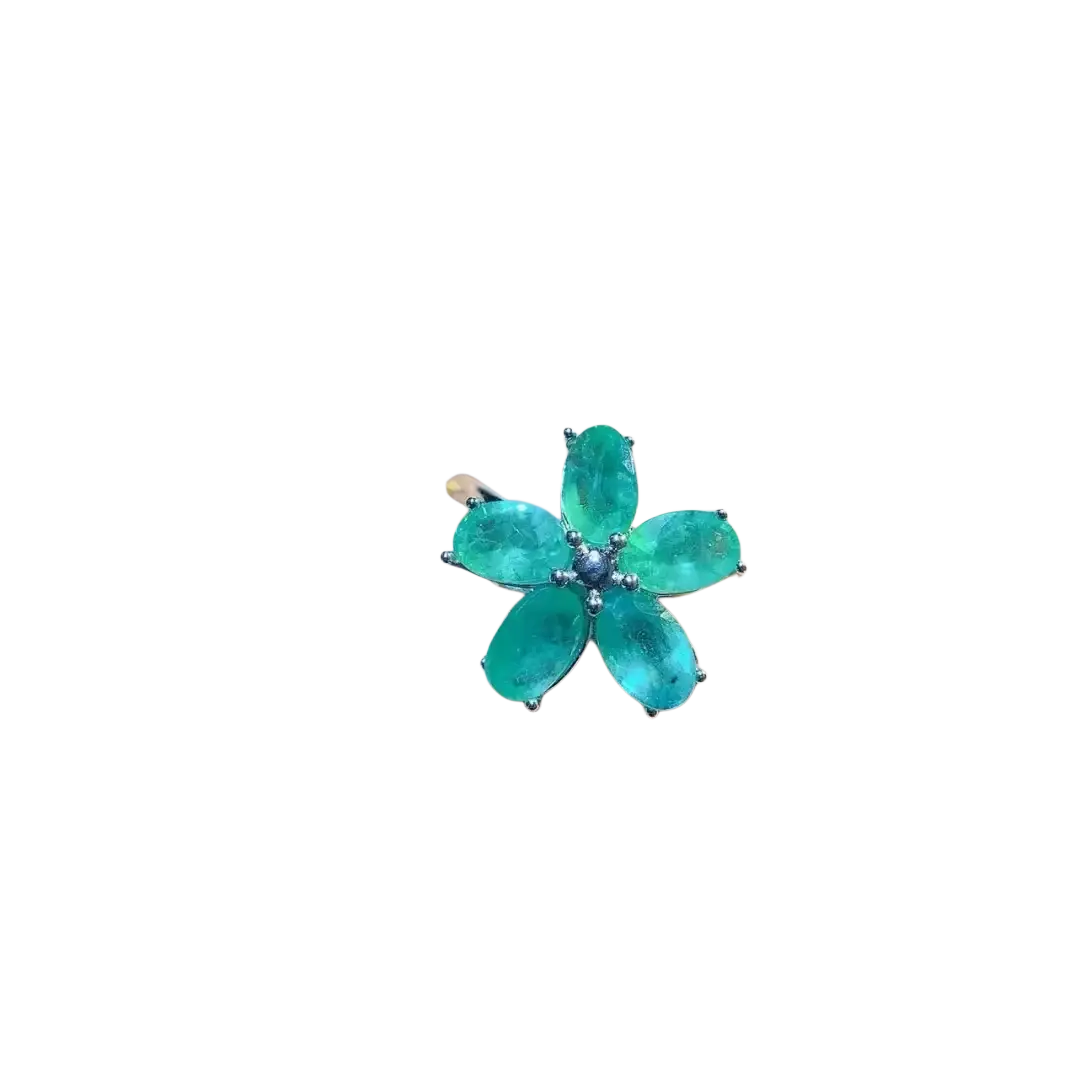 Emerald flower silver ring featuring a vibrant emerald green flower with five faceted petals and silver-toned metal