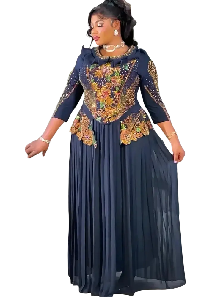 Emerald green beaded maxi dress with navy blue plus-size bodice featuring intricate gold floral embroidery and ruffled neckline