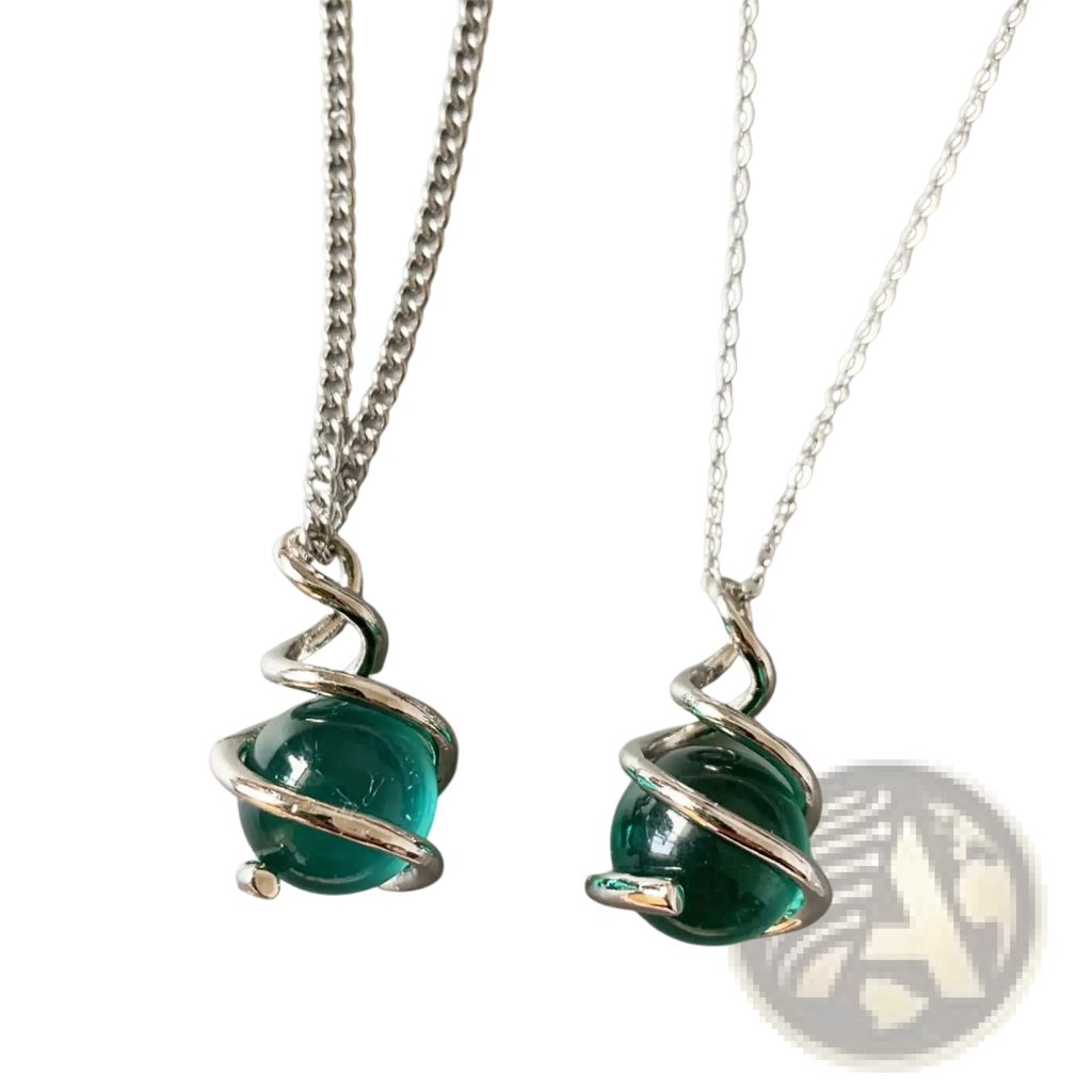 Two silver-toned necklaces featuring vibrant teal glass spheres encircled by elegant twisted metal wire pendants