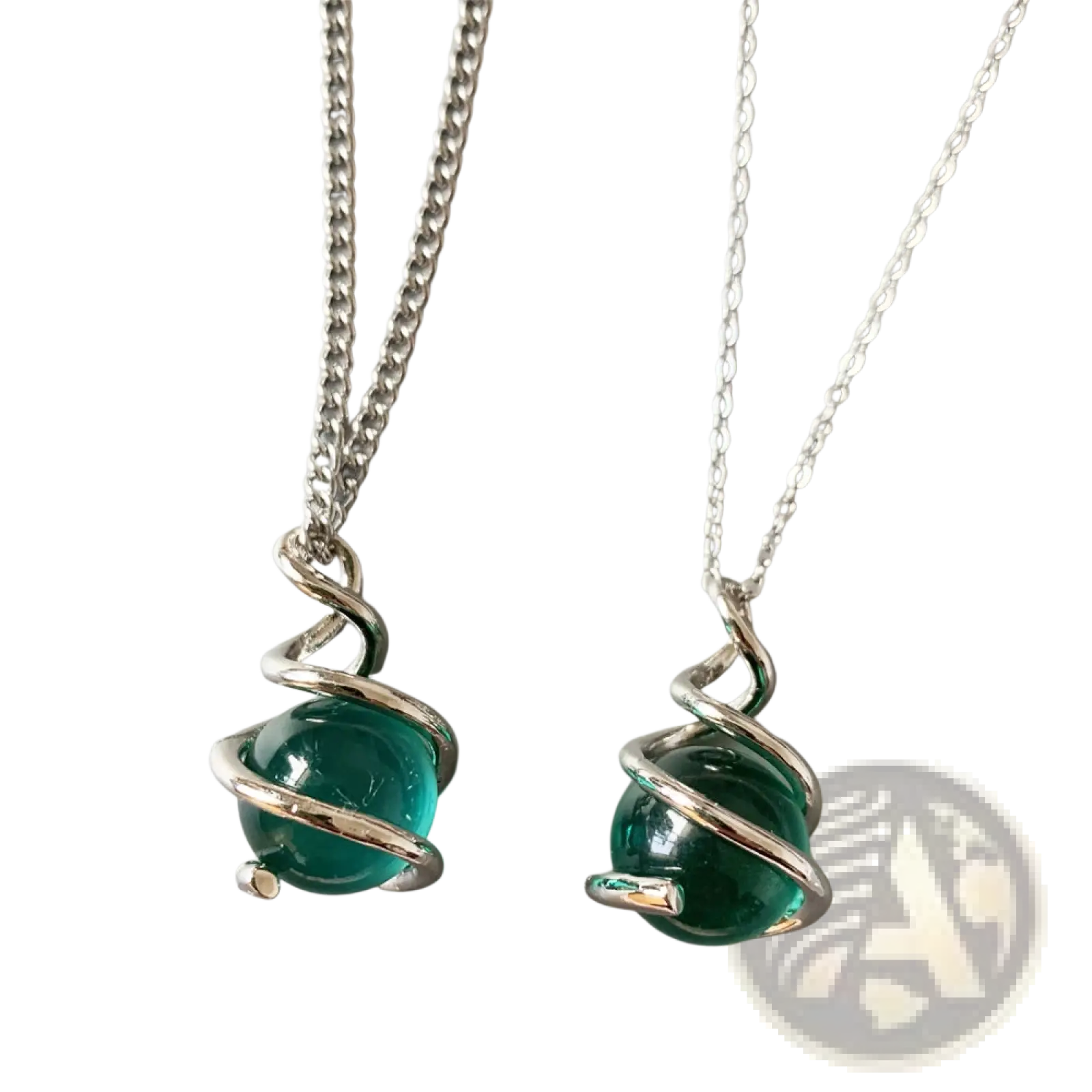 Two silver-toned necklaces featuring vibrant teal glass spheres encircled by elegant twisted metal wire pendants