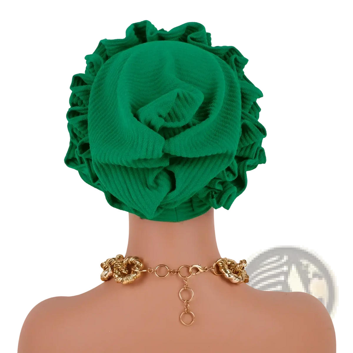 Emerald green ruffled turban cap with ribbed texture and voluminous flower-like folds in a soft fabric