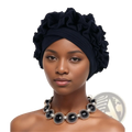 Black ruffled turban cap with soft fabric and layered voluminous folds from the emerald green ruffled turban cap collection