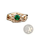 Emerald rose gold ring with a central emerald-cut green gemstone and diamond-accented leaf and vine design