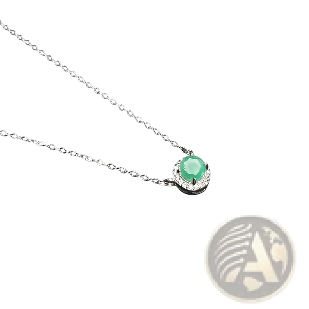A sterling silver necklace with a round green jade pendant surrounded by sparkling diamonds in emerald jewelry set