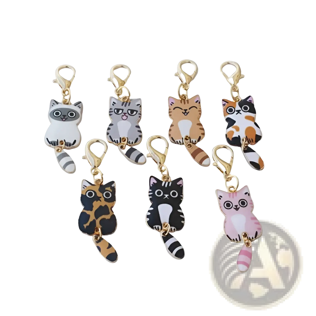 Set of seven colorful enamel cat keychains with striped tails and gold-toned clasps for cute charms collection