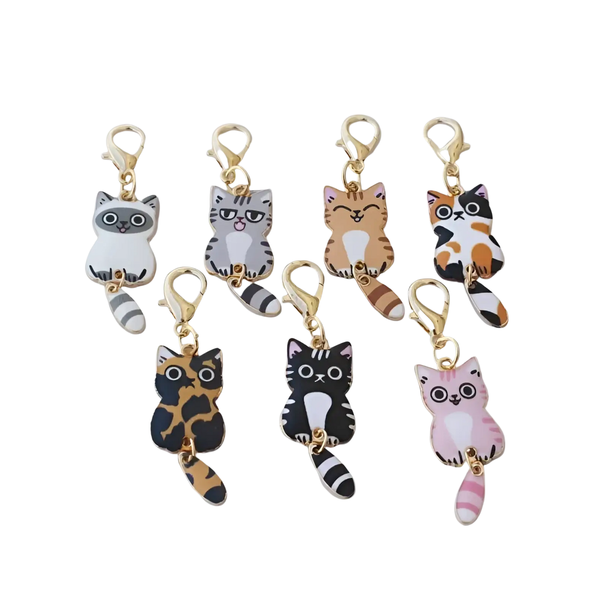 Set of seven colorful enamel cat keychains with striped tails and gold-toned clasps for cute charms collection