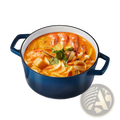 Deep blue enameled cast iron dutch oven with black rim and handles filled with vibrant orange seafood stew