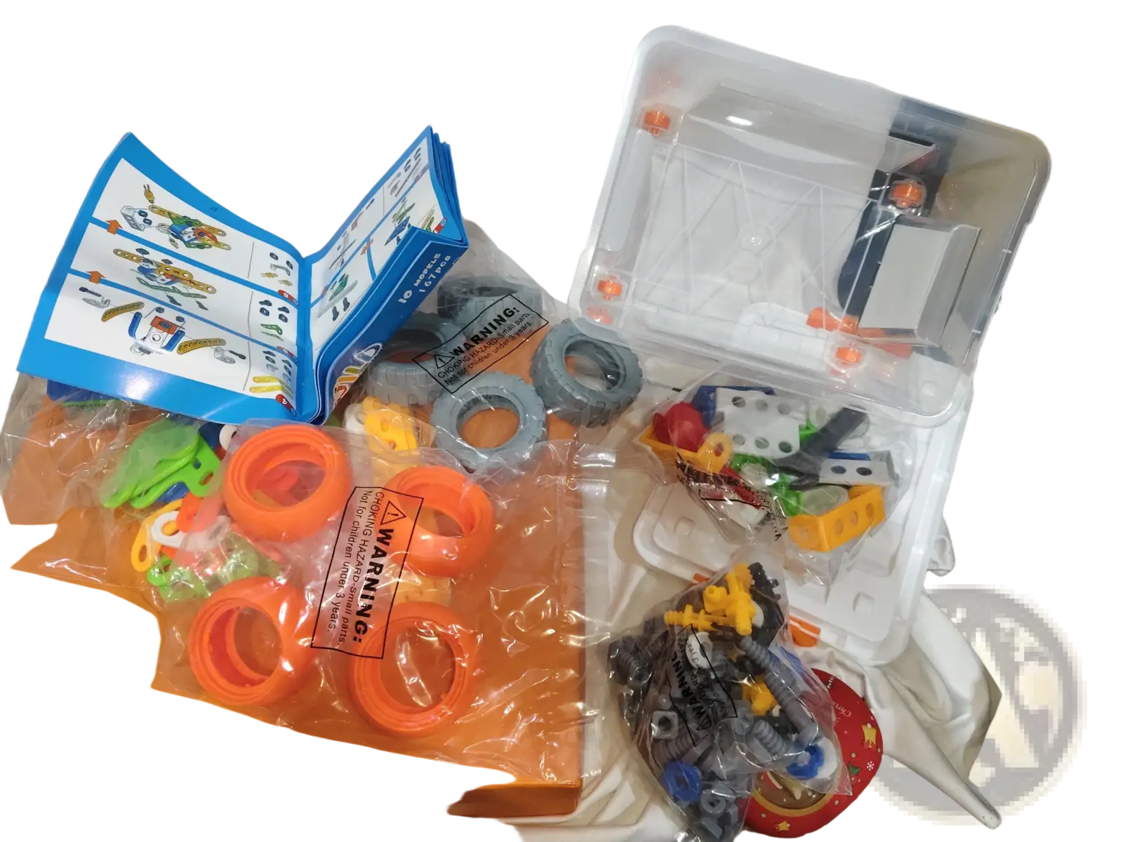 Orange plastic toy construction set with colorful interlocking pieces and blue instruction manual for engineering vehicle robot 10 in 1 building block set