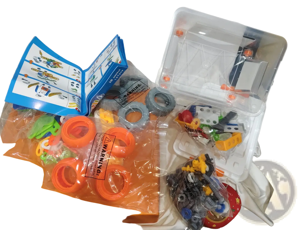 Orange plastic toy construction set with colorful interlocking pieces and blue instruction manual for engineering vehicle robot 10 in 1 building block set