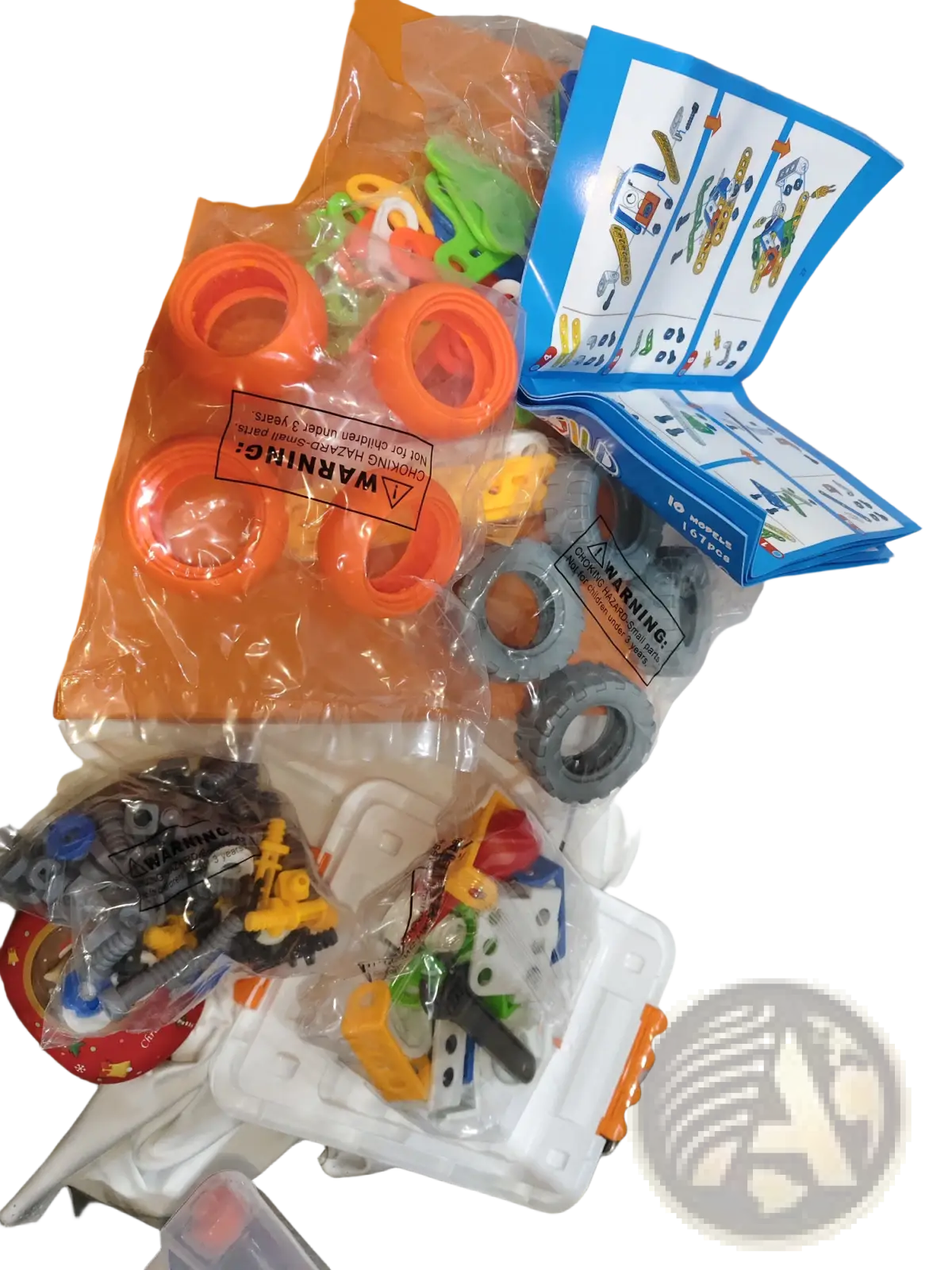 Orange and gray plastic toy construction set with instruction manual from engineering vehicle robot 10 in 1 building block set