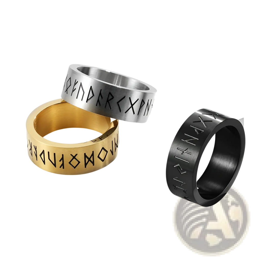 Three metallic engraved runic titanium steel band rings for men and women in gold and silver tones with blackened finishes
