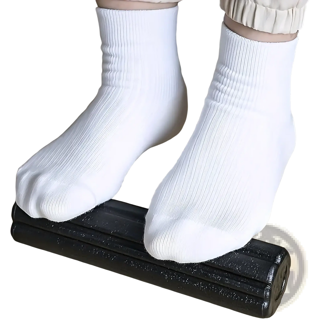 White ribbed ankle socks worn with beige pants resting on a black Epp triangle foam yoga block and roller