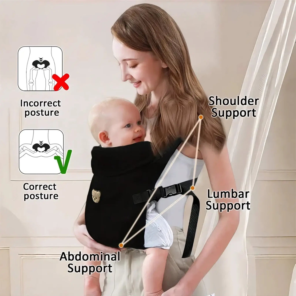 Black ergonomic baby carrier with adjustable straps and gold emblem designed for front and back travel use