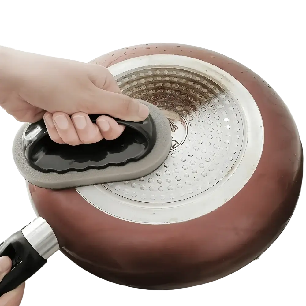 Ergonomic kitchen scrubber sponge with handle in black and gray silicone featuring a textured rounded head for pan cleaning