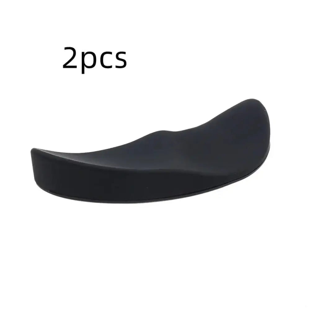 Black ergonomic silicone gel mouse wrist rest with smooth contoured surface and gliding base for comfort