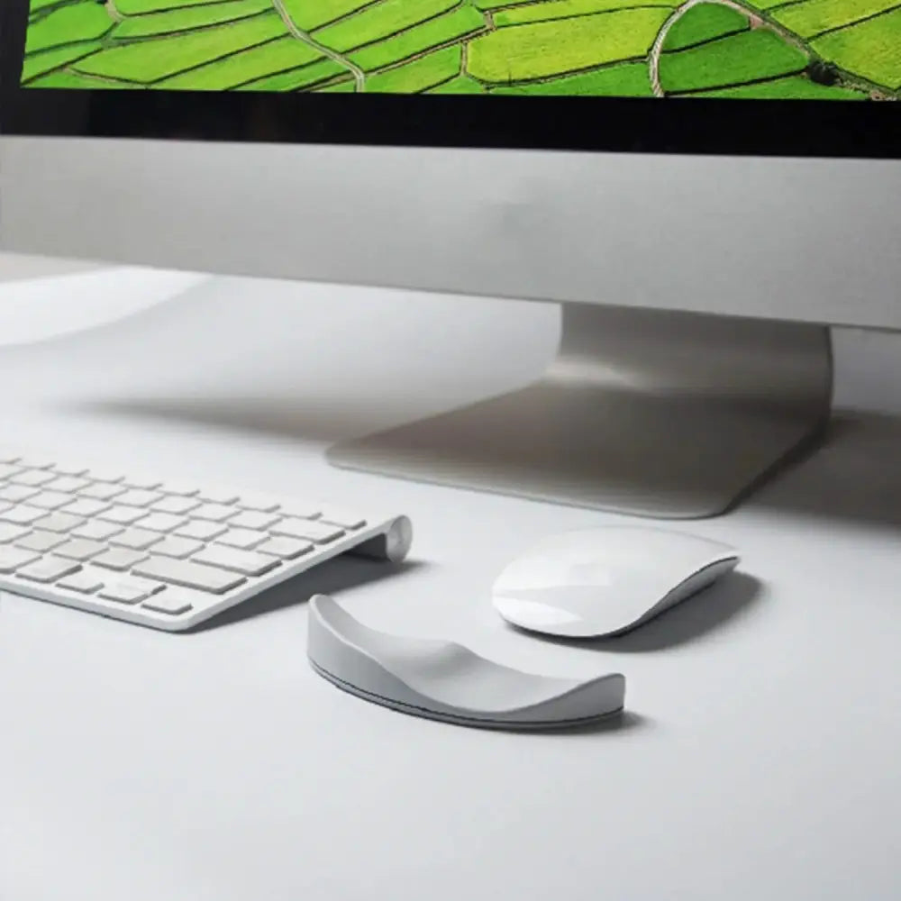 White ergonomic silicone gel mouse wrist rest with smooth curved design matte finish and gliding base