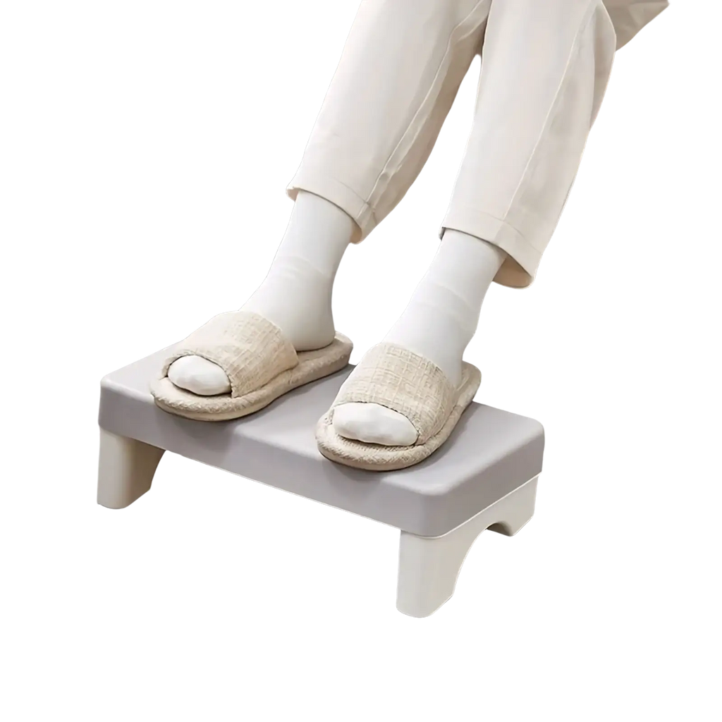 Light gray ergonomic under desk plastic footrest with rounded edges and sturdy slightly curved legs for comfort