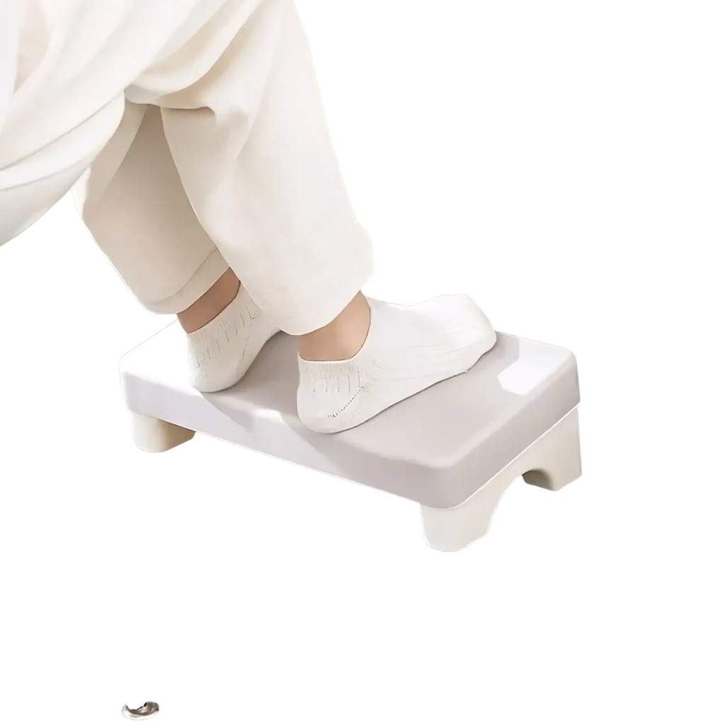 Ergonomic under desk white plastic footrest with rounded edges and four short legs for comfortable support