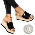 Black espadrille wedge sandals with textured straps, woven jute platform, denim details, and gold-tone metal accent