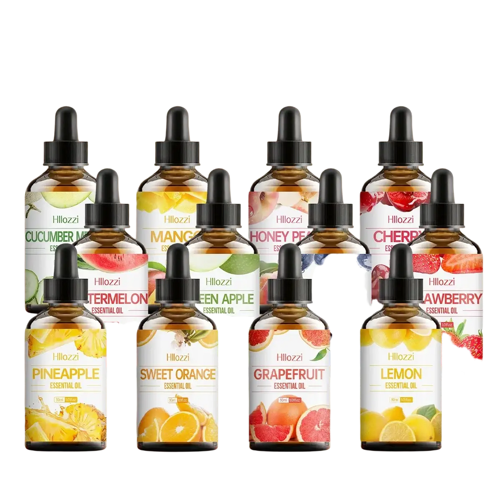 A collection of Hillozzi essential oil bottles in amber glass with black droppers and fruit-themed labels for skin care