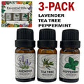 Set of three amber glass essential oil bottles with black caps labeled lavender tea tree and peppermint for aromatherapy