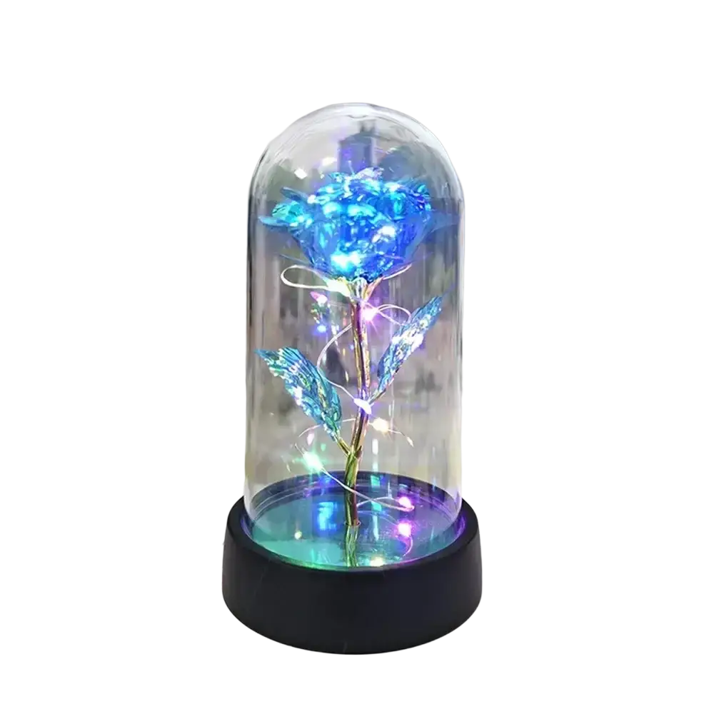 A glowing blue gold rose with iridescent petals and metallic stem inside a glass dome led light on black base
