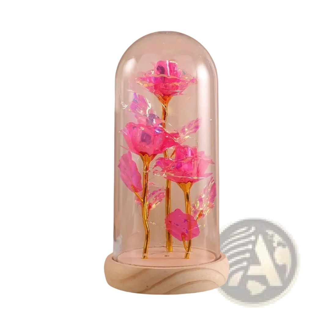 A vibrant pink glittery eternal gold rose with golden stems inside a glass dome on a wooden base with led light