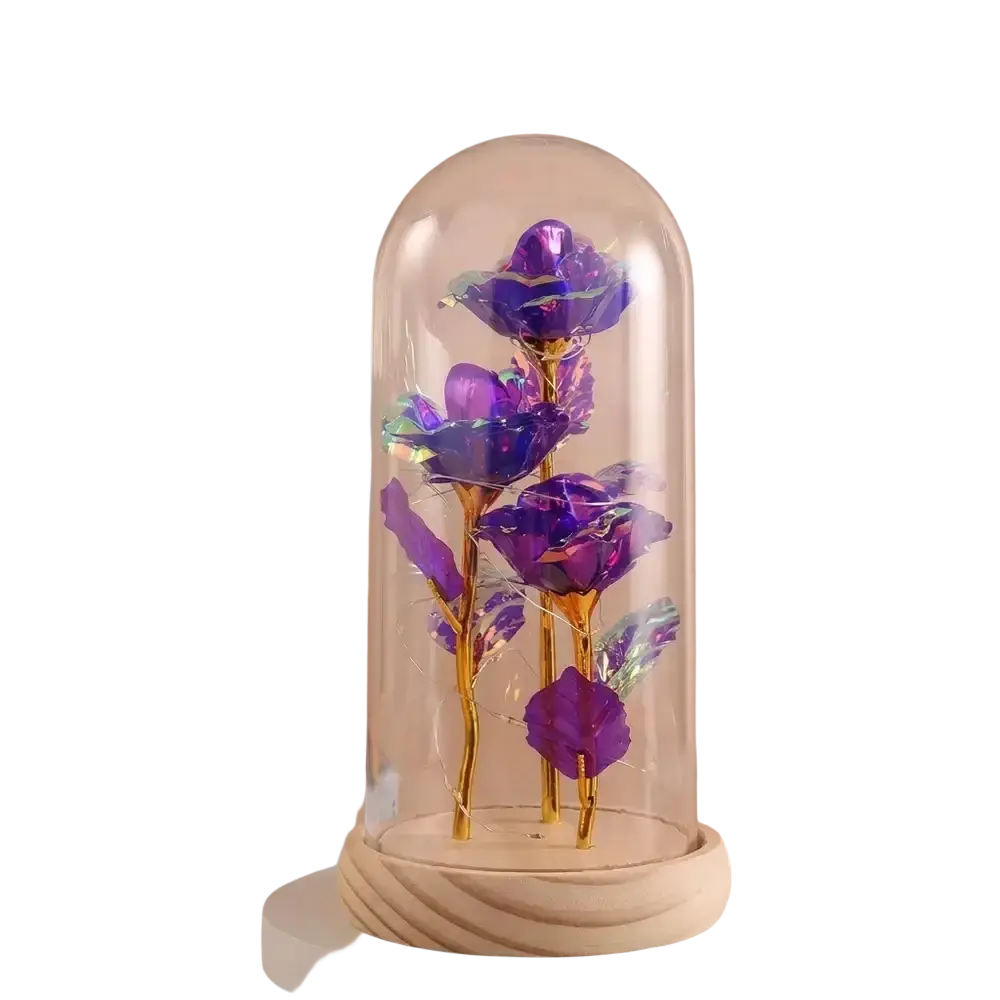 A set of shimmering purple metallic gold roses inside a glass dome with led light on a wooden base gift decor