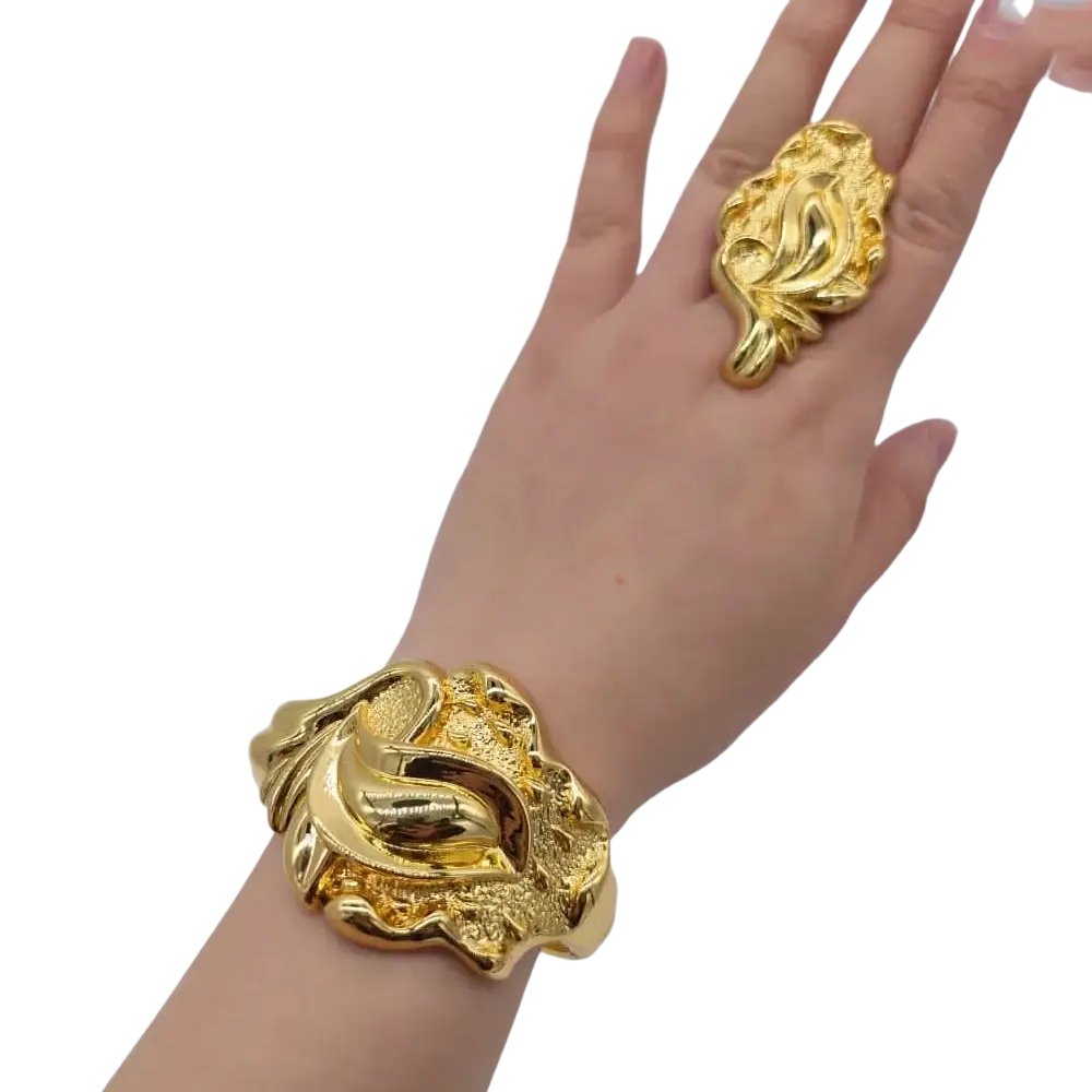 Gold-toned sculptural cuff bracelet with intricate leaf detailing and texture in Ethiopian Arabic hand luxury jewelry color bangles