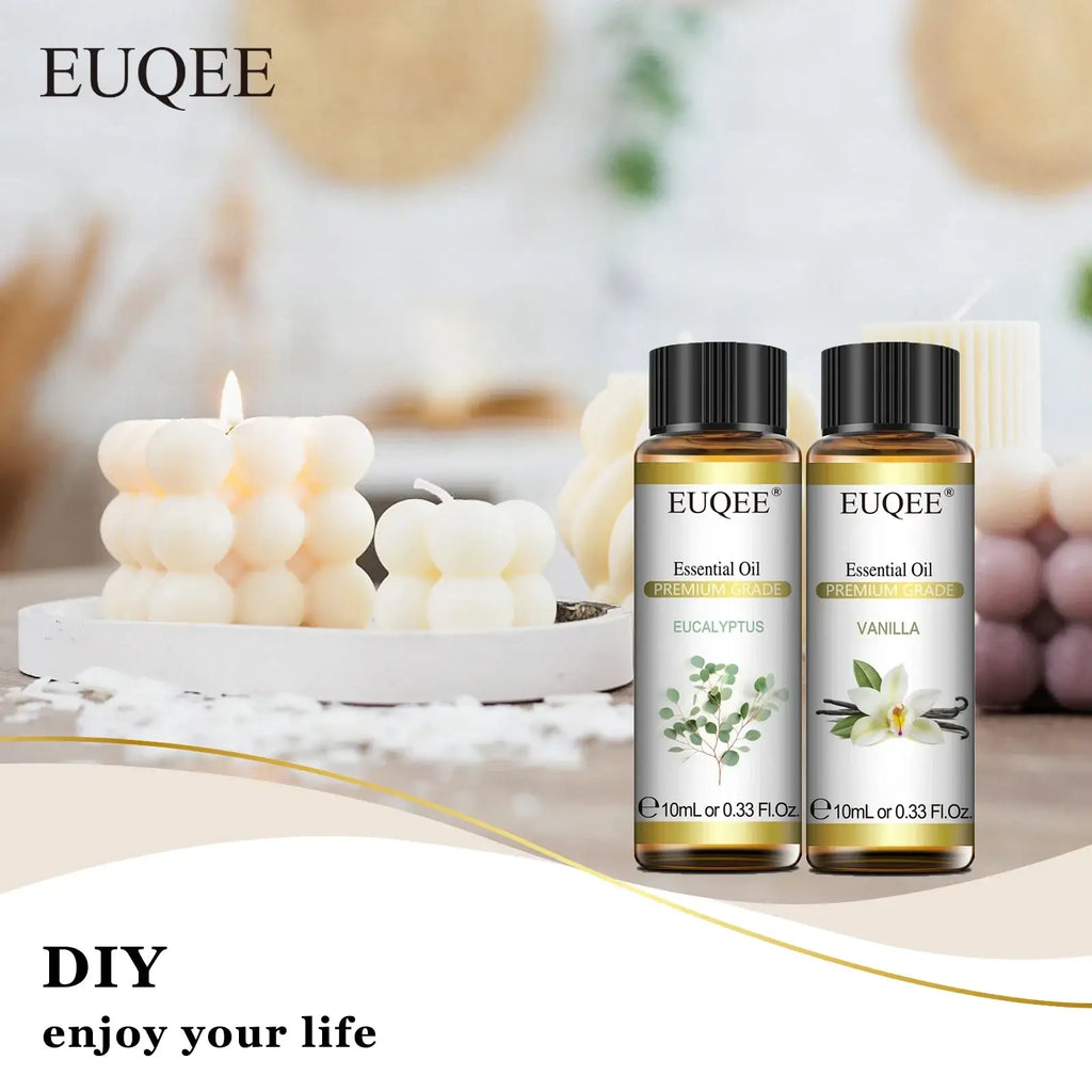 Two amber glass bottles of euqee pure essential oil with black caps featuring eucalyptus and vanilla botanical illustrations