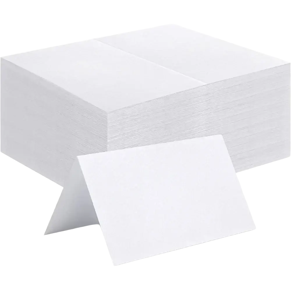 Stack of white folded eucalyptus leaf place cards made of paper for wedding table seating arrangements