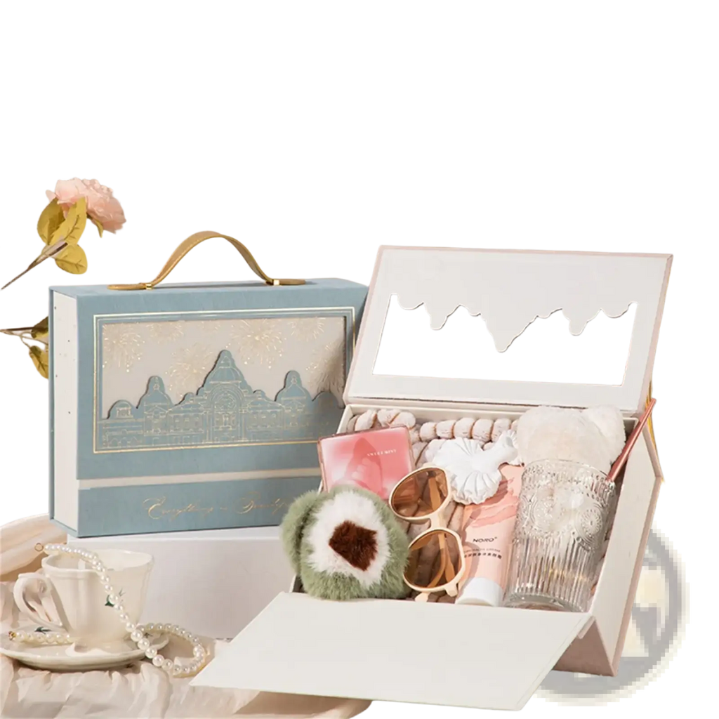 Light blue European style wedding gift box with gold handle and cityscape design open showing pink white beauty products