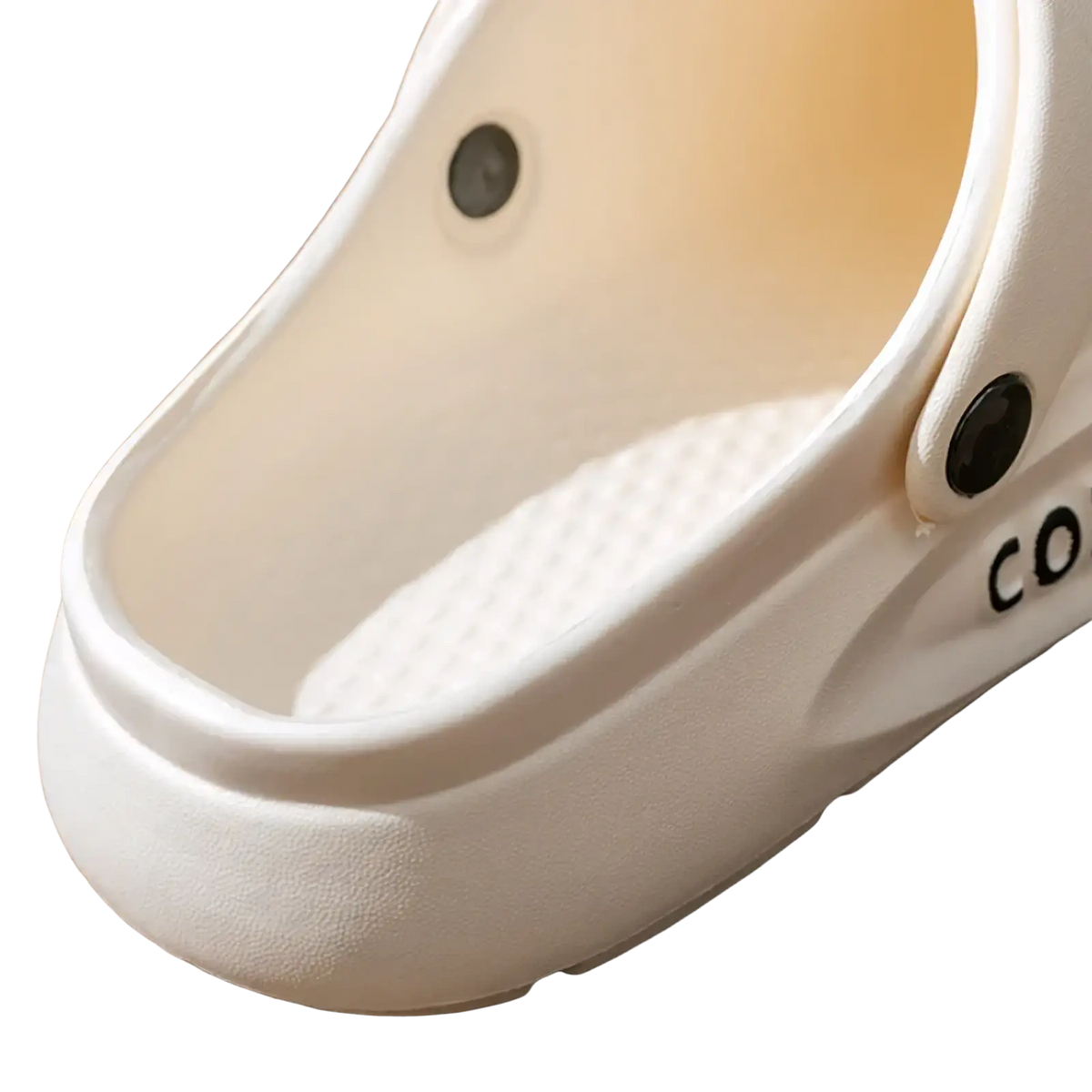 White eva slip-on cushion clog sandal with textured insole and black circular fasteners