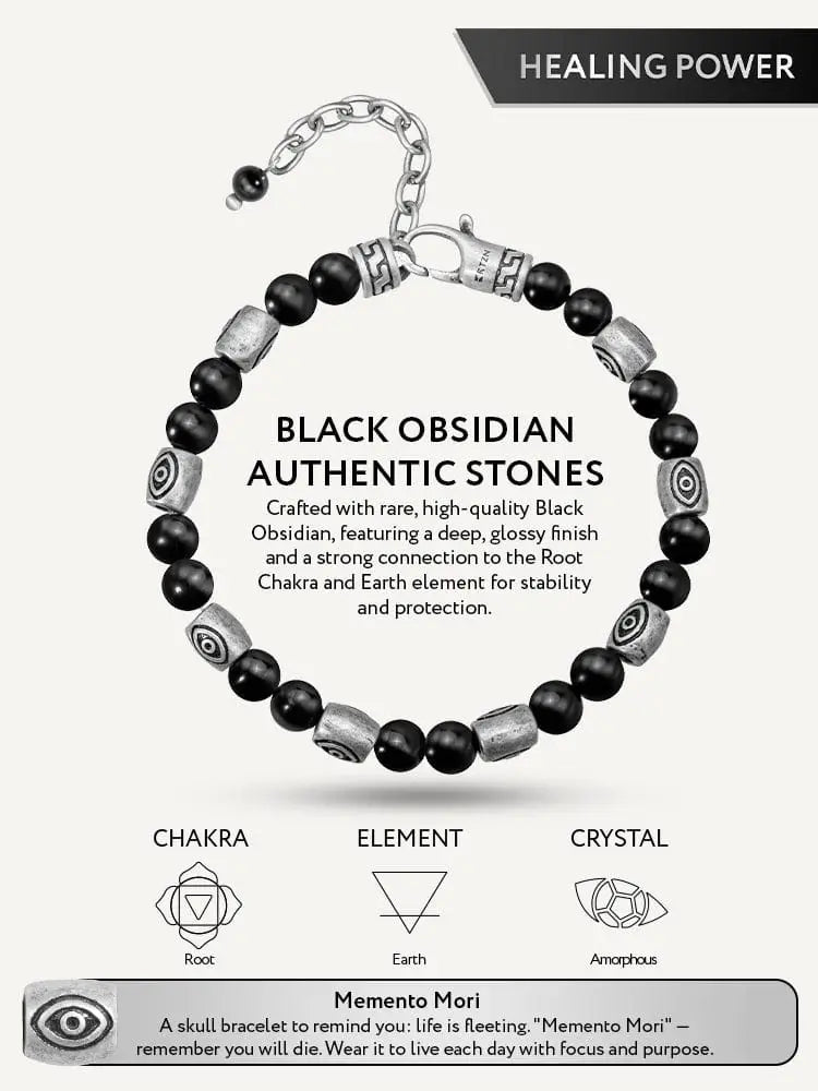 A sleek black obsidian and silver evil eye protection bracelet with smooth beads and engraved geometric patterns