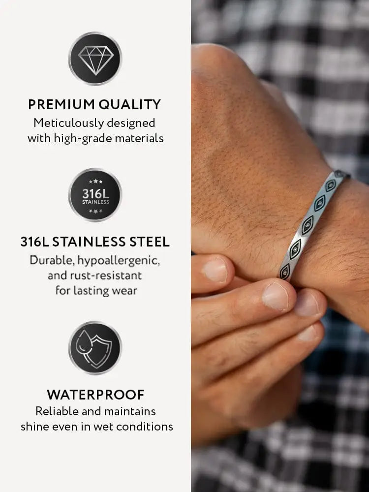 A sleek silver 316l stainless steel cuff bracelet with teal geometric engraved evil eye pattern