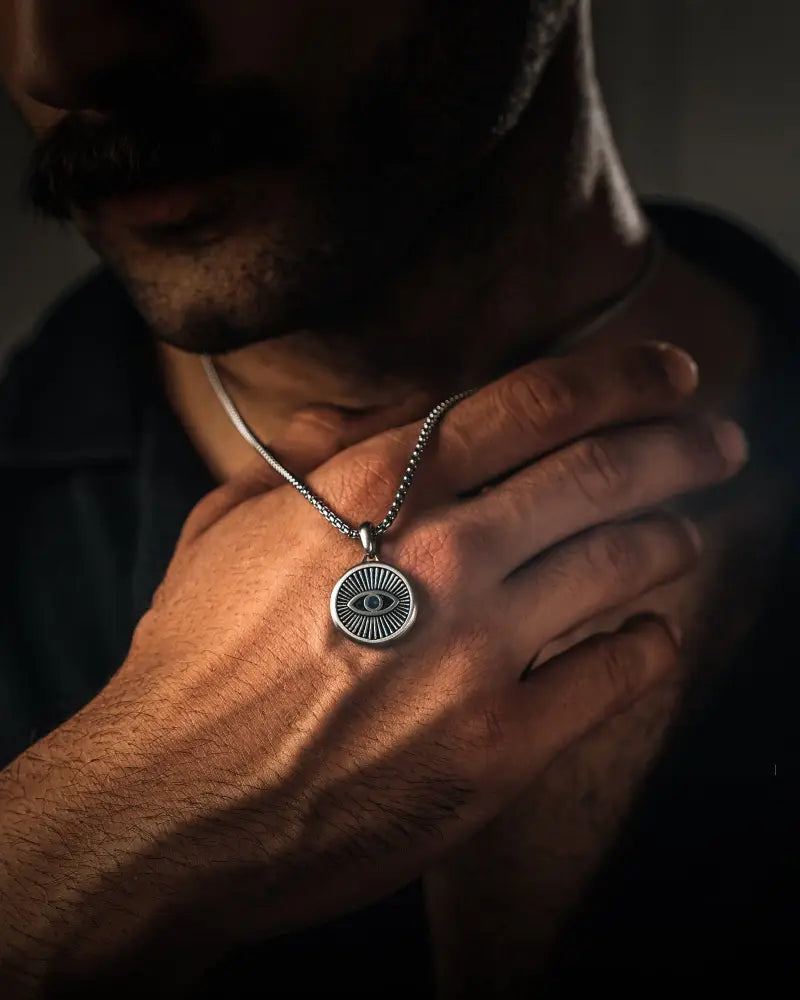 Silver evil eye stainless steel pendant necklace with textured box chain for stylish everyday wear