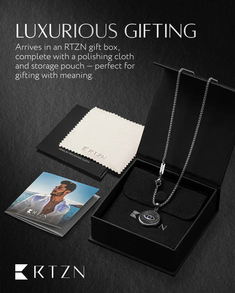 Silver evil eye stainless steel pendant necklace with textured box chain presented in an rtzn gift box