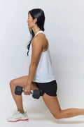 Black hexagonal dumbbell with silver metal handle shown alongside excel women’s black camouflage athletic workout shorts