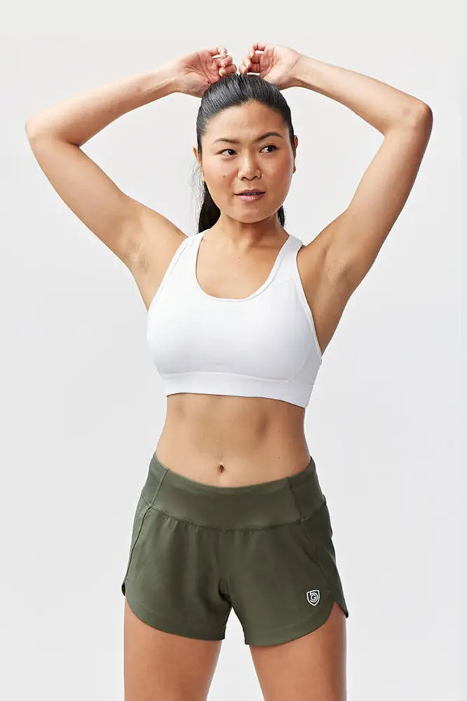 Olive green high-waisted athletic shorts with elastic waistband and side pockets for women’s workout use