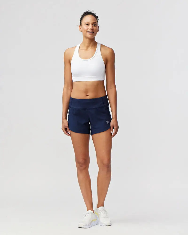 Excel women’s black camouflage athletic workout shorts in navy blue with a subtle logo on the lower right leg